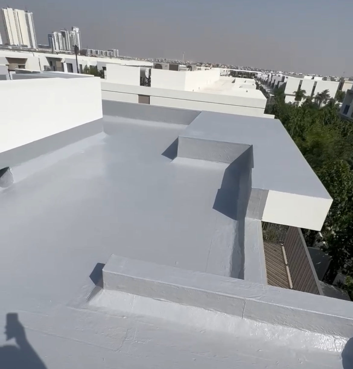 Chemical waterproofing application by Fix It Mates, highlighting the use of liquid membrane technology to create a seamless, protective barrier against water infiltration on a construction surface.