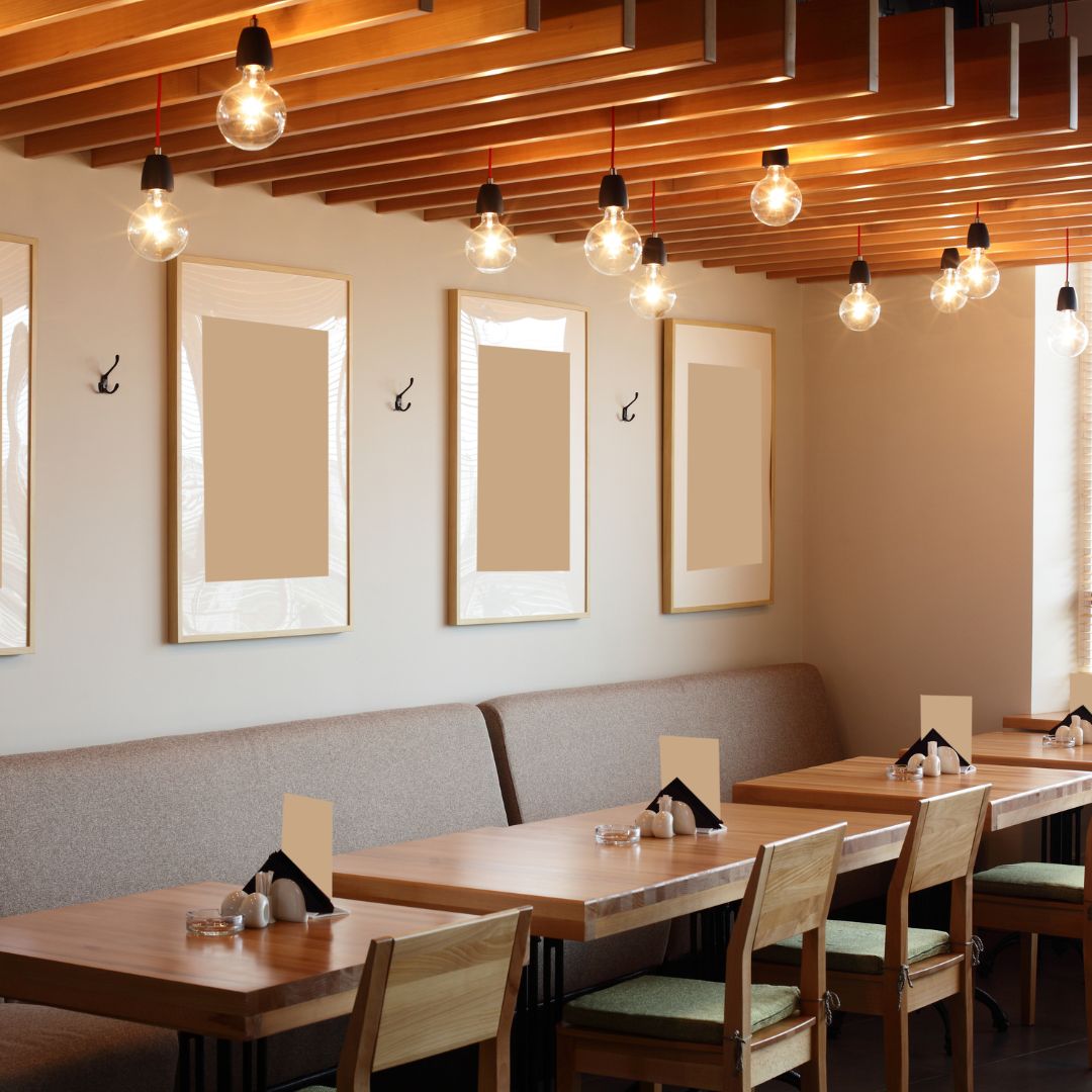 A custom-designed restaurant table and chairs crafted by the Fix It Mates joinery team, featuring a polished wooden finish, sturdy construction, and a sleek, modern design, set in a restaurant dining area.
